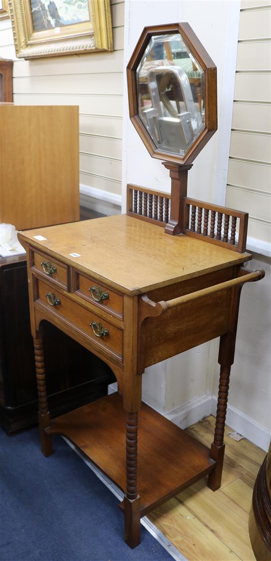 An Edwardian walnut shaving stand W.76cm.